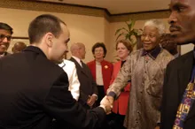 Jason Ray shaking hands with Nelson Mandela