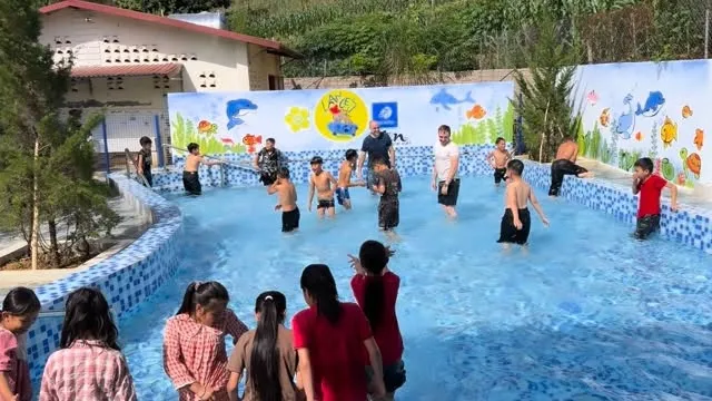 The boys are all in while the girls are a little more cautious! Our 3rd pool launch in Van Ho, Son La.
